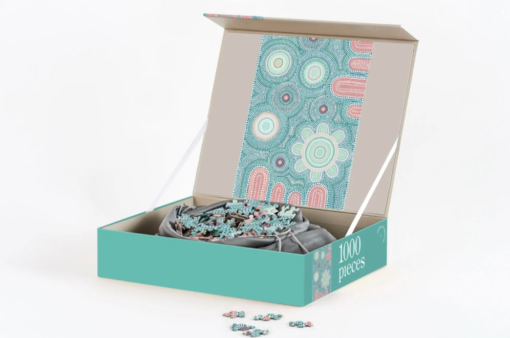 Giwaa-Yubbaa Puzzle featuring Indigenous artwork in blue and pick