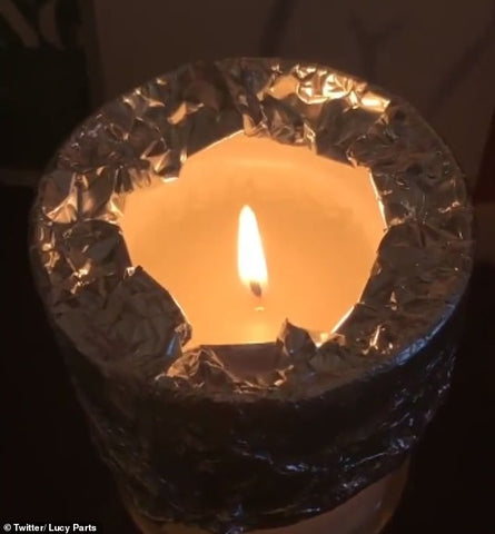 Burning Candle Wrapped and Tented in Tin Foil from Daily Mail