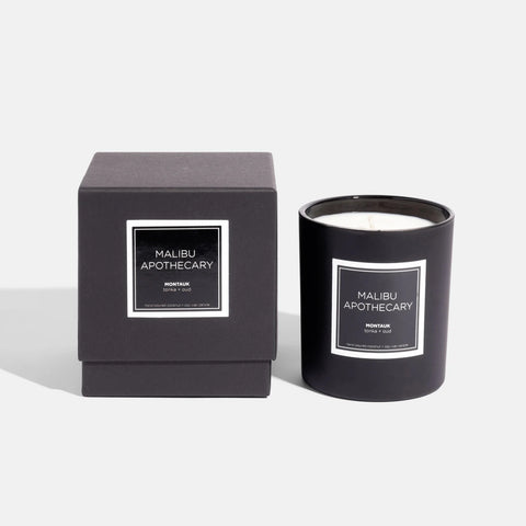 Malibu Apothecary matte black candle next to matte black gift box