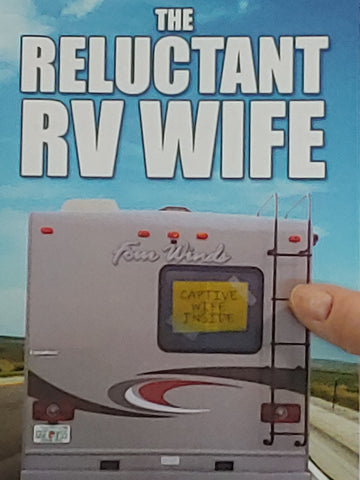 Author Gerri Almand holds papeback copy of The Reluctant RV Wife