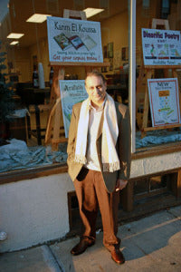 Karim El Koussa in front of his sign