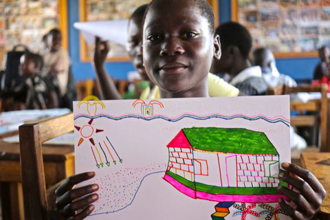 Child in Uganda with her drawing