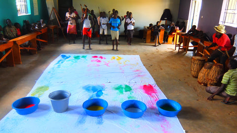 Collecting painted footprints of children dancing in Uganda