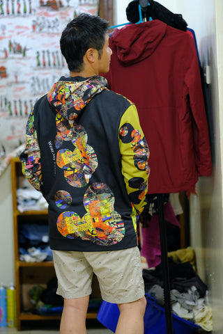 Shingo Ogawa shows the back of his Unissograff hoodie