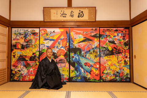 EKOIN Chief priest Sesshu Kondo sitting in front of a Unissograff screen door