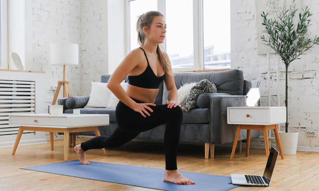 An image of a Female woman doing yoga at home