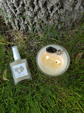 luxury crystal infused earth sign ritual mist and soy candle on grass