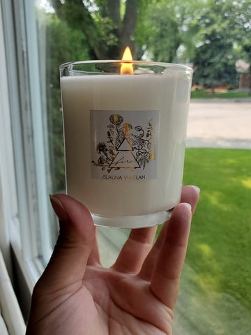 hand holding luxury soy candle for fire signs