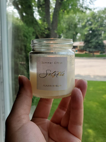 hand holding luxury soy summer candle 