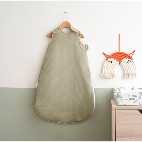 Sage Green Organic Sleeping Bag (0-6 Months) on a wall-mount hanger in a Scandi Sage Green nursery | Baby Sleeping Bags | Baby Sleep Bags, Shawls, Swaddles & Sleepbags | Nightwear | Nursery - Clair de Lune UK