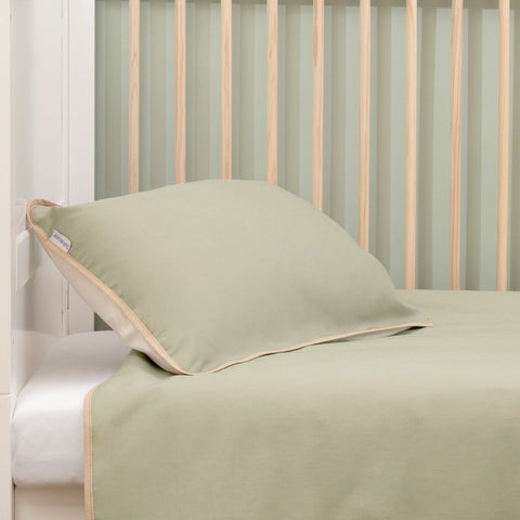 The pillowcase of the Organic Reversible Cot Bed/Toddler Bed Duvet Cover Set | Cot, Cot Bed & Toddler Bed Bedding - Clair de Lune UK