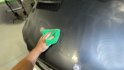 cleaning car with microfiber towel 