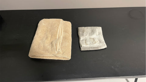 folded towels on a table 