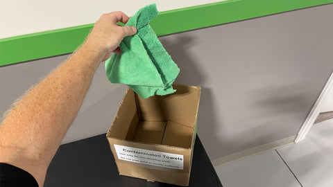 putting microfiber towel into a box 