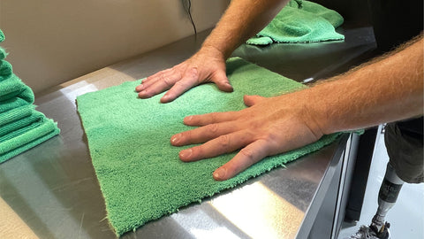 inspecting microfiber towel 