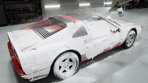 spraying car with foam blaster 