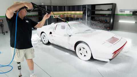 spraying car with foam blaster 