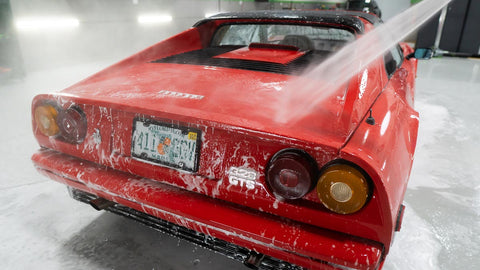 rinsing car with water