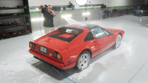 rinsing car with water