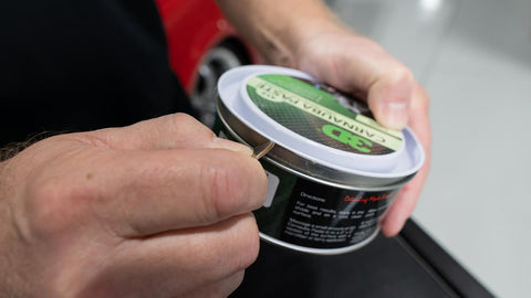 Using a quarter to open a can of car wax