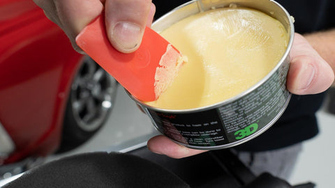 scraping car wax out of a can