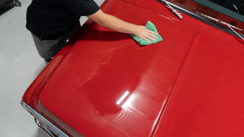 wiping wax of the surface of a car