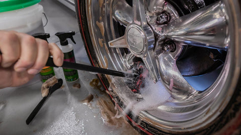 scrubbing tire with with soapy brush 