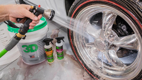 spraying soap off tire rims