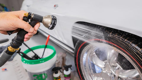 spraying soap off tire rims