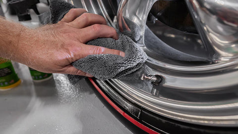 drying car rims with a microfiber towel
