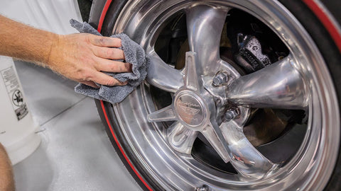 polishing tire rim with microfiber towel