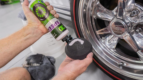 applying rim cleaner to a sponge 