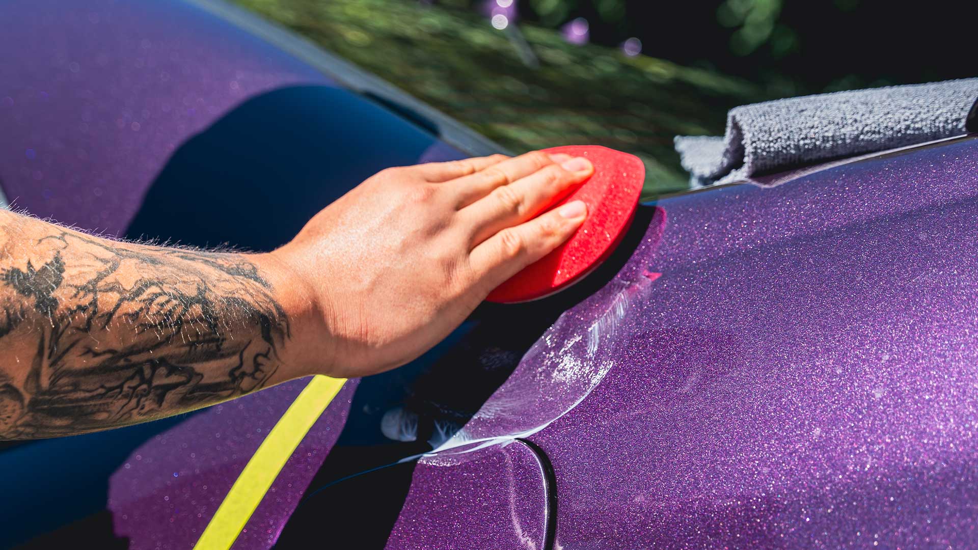 applying ceramic wax to car panel