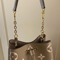 Photo of strap extenders on LV bucket bag.