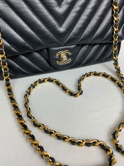 Photo of Chanel purse with new Mautto gold chain and black leather woven through.