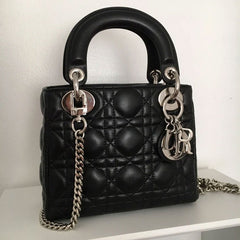 Dior handbag with silver luxury chain strap.