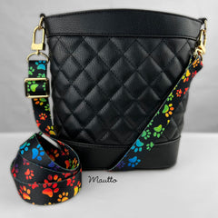 Colorful paw print design strap for purse or handbag.