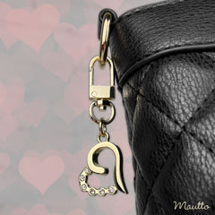 Light gold heart with diamond accents and swivel clip.