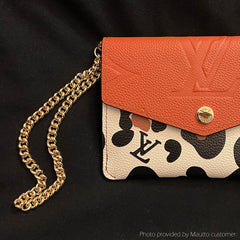 LV wallet shown with accessory gold chain wrist strap by Mautto.