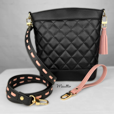 Custom black leather strap with pink leather woven through. Also shown with matching pink leather tassel and accessory keychain wrist strap.