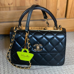 Customer photo showing leather woven chain strap on Chanel handbag.