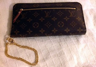 Gold double-curb chain wristlet strap added to Louis Vuitton wallet.