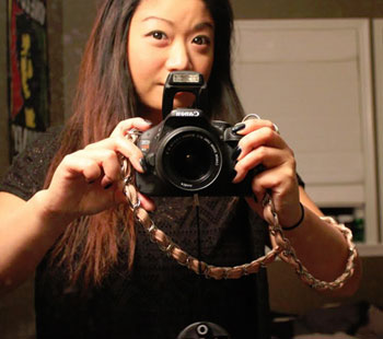 Chain with leather weave strap on camera.