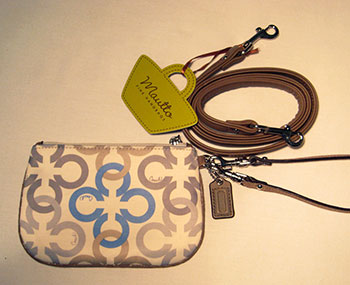 Coach clutch with new wristlet and shoulder strap.