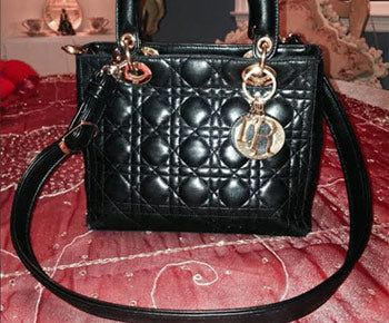 Lady Dior handbag with new shoulder strap.