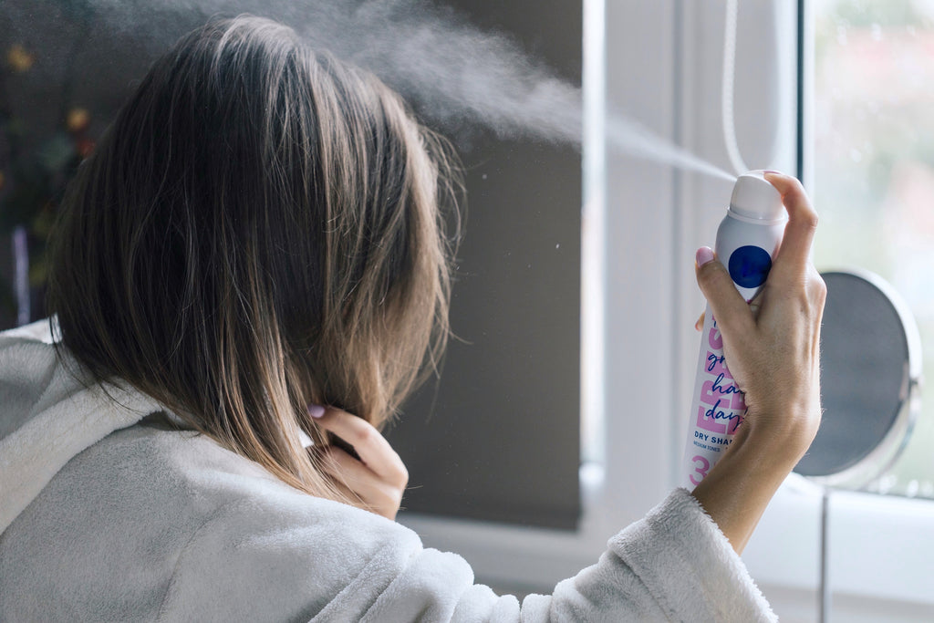 women hair spraying