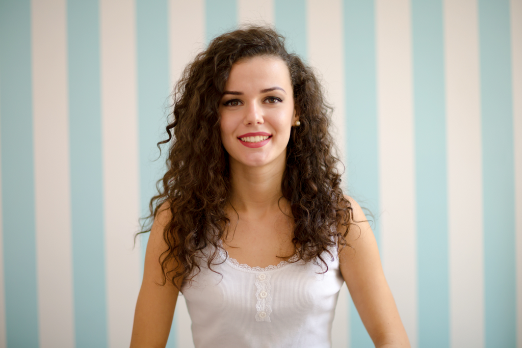 Women with curly hair standing