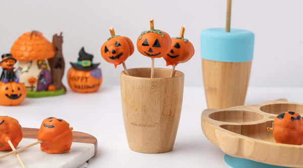 Pumpkin cake pops in a bamboo cup