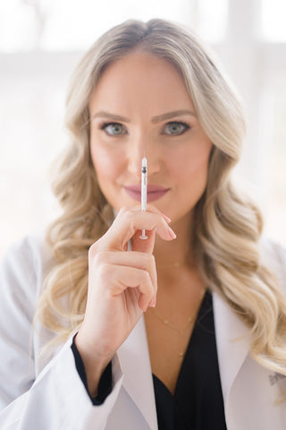 Photo of Brandi Gregge holding a needle 