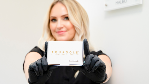 Brandi Gregge holding a box of Aquagold.